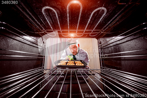 Image of Chef cooking in the oven.