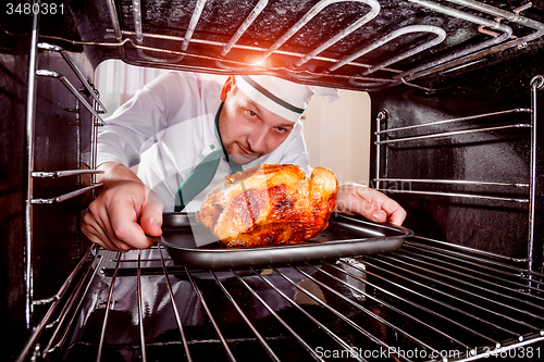 Image of Cooking chicken in the oven.