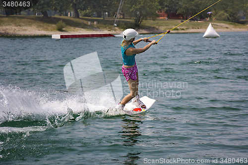 Image of Young girl wakeboarder