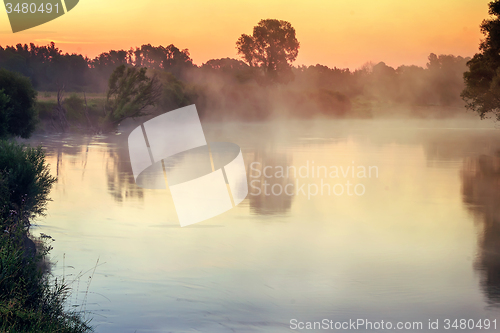Image of Early foggy morning and a small river.