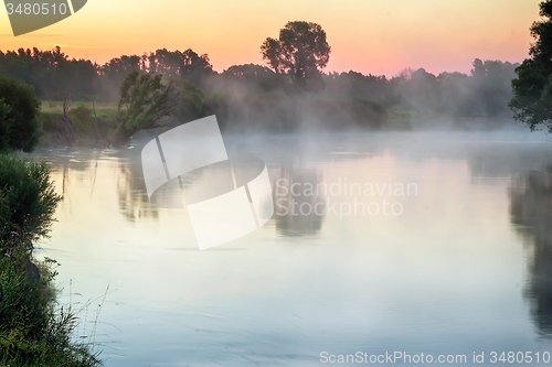 Image of Early foggy morning and a small river.