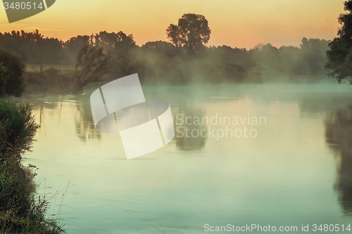 Image of Early foggy morning and a small river.