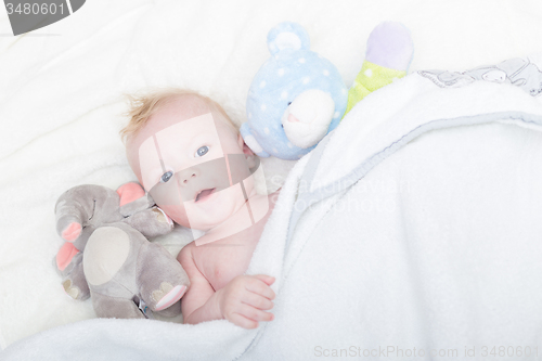 Image of Baby with plush toy.