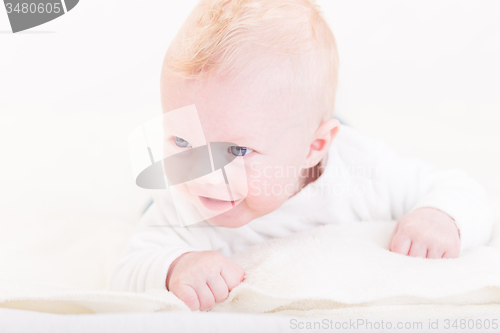 Image of Baby with plush toy.