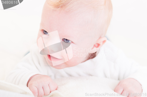 Image of Baby with plush toy.