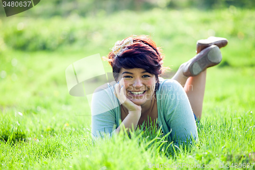 Image of Teenage Girl Laying in Grass