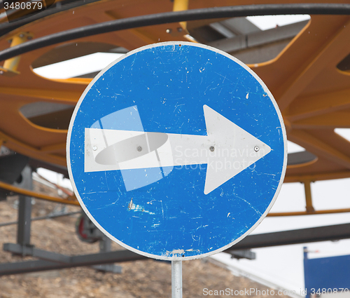 Image of Blue road sign with white arrow pointing right