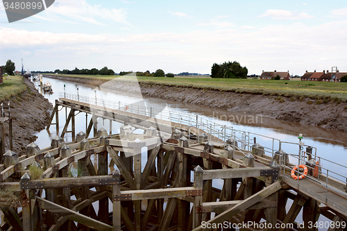 Image of Approach on River Nene at low tide to Crosskeys Bridge at Sutton