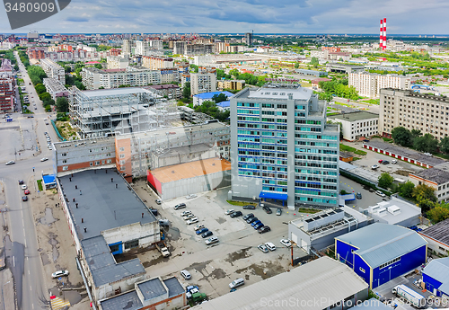 Image of Aerial view of office building and urban quarters