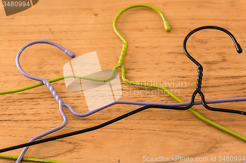 Image of three colored hangers