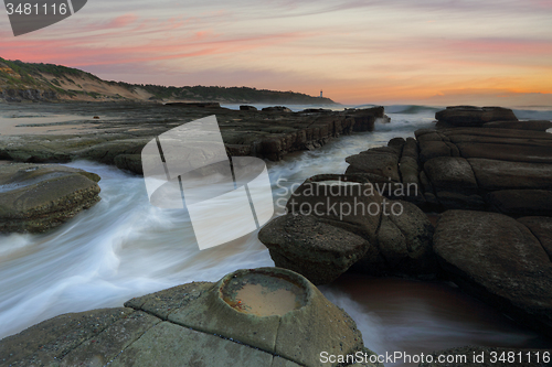 Image of Ocean flowing in and out of the rock chasm Norah Head