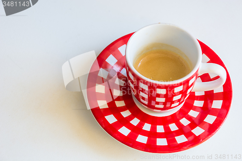 Image of Red striped cup of coffee