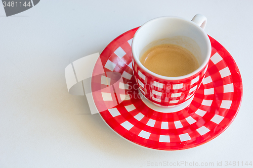 Image of Red striped cup of coffee