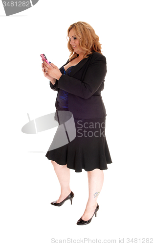 Image of Businesswoman texting on her cellphone.
