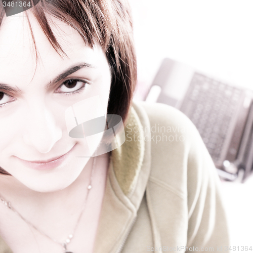 Image of Young woman in bed