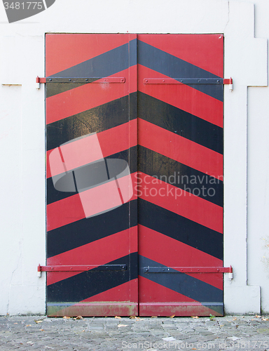 Image of Old red door of a building