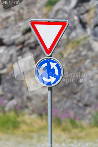 Image of Roundabout crossroad road traffic sign, blue