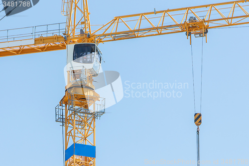 Image of Yellow crane and blue sky 