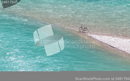 Image of Bike parked at an impossible spot, middle of a river