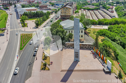 Image of Stella with eternal flame and museum building 