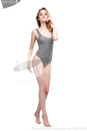 Image of Attractive young woman in gymnastic suit