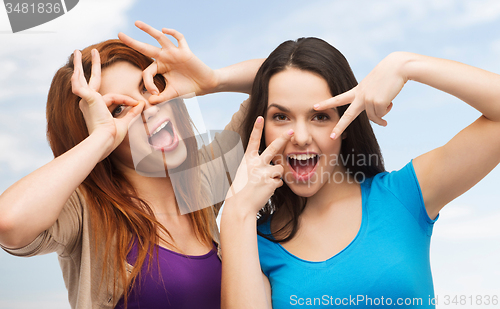 Image of smiling teenage girls having fun