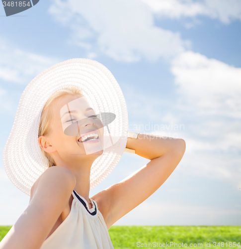 Image of beautiful woman enjoying summer outdoors