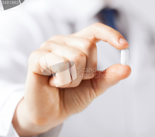 Image of doctor with pill in hospital