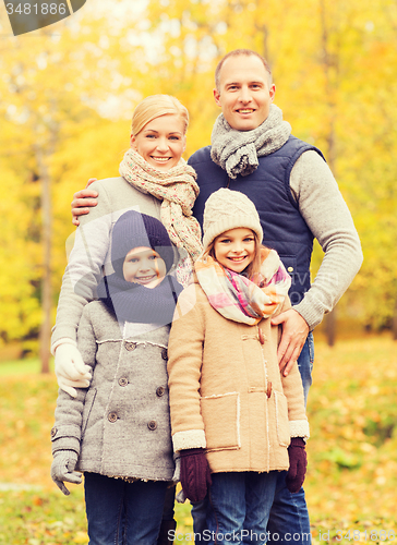 Image of happy family in autumn park