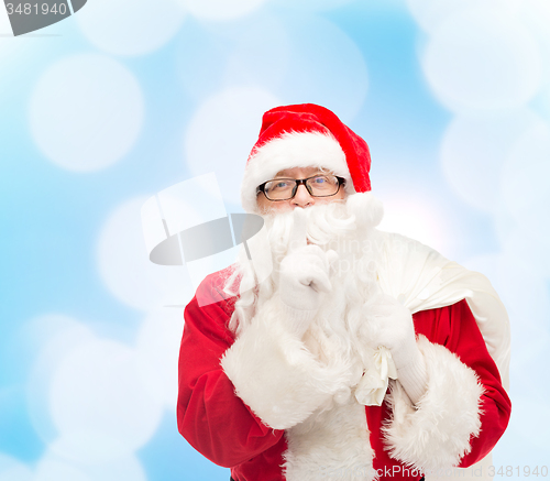 Image of man in costume of santa claus with bag