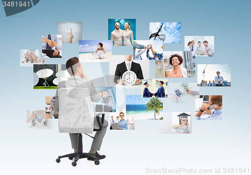 Image of businessman sitting in office chair from back