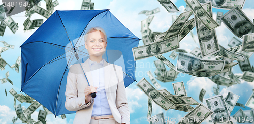 Image of happy young businesswoman with umbrella outdoors