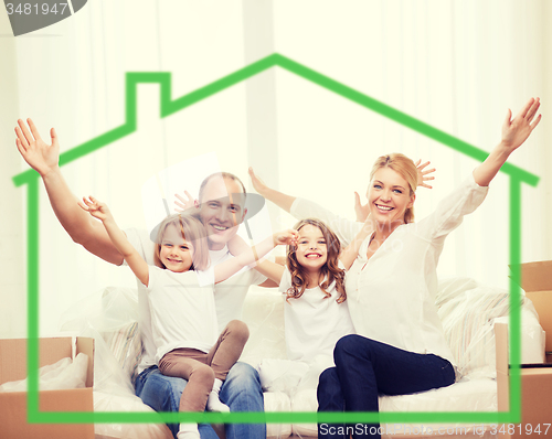 Image of smiling parents and two little girls at new home