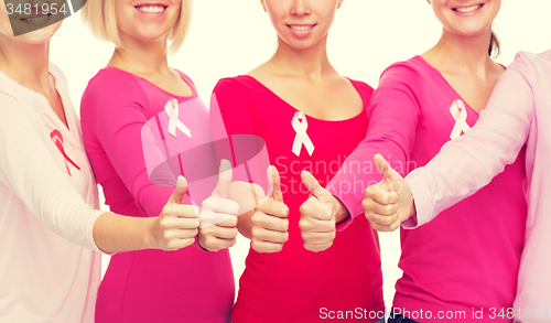 Image of close up of women with cancer awareness ribbons