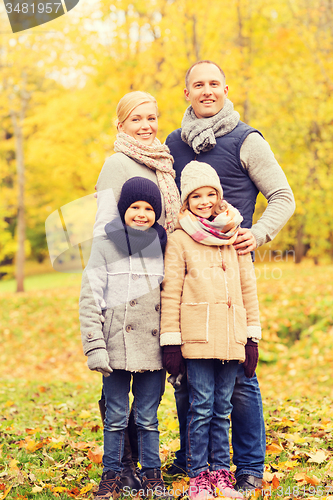 Image of happy family in autumn park