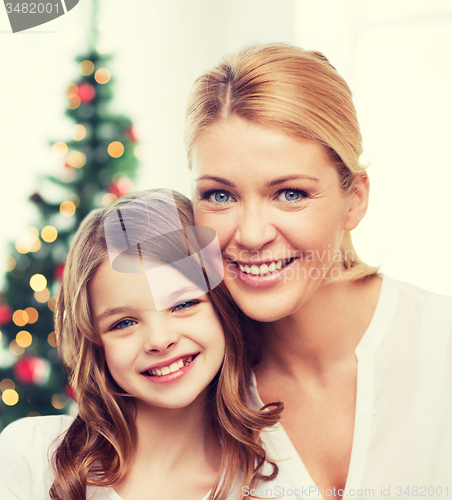 Image of smiling mother and little girl
