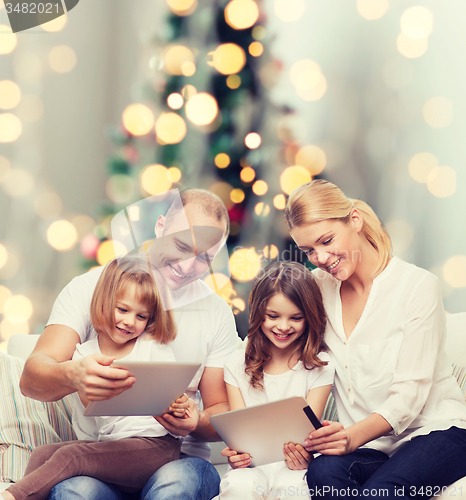 Image of happy family with tablet pc computers