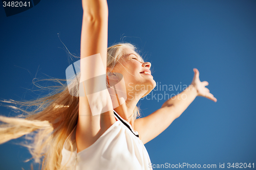 Image of beautiful woman enjoying summer outdoors