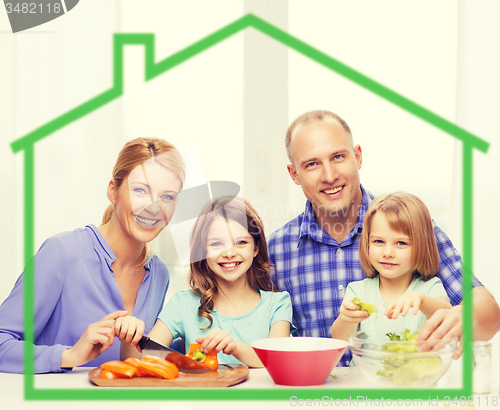 Image of happy family with two kids making dinner at home