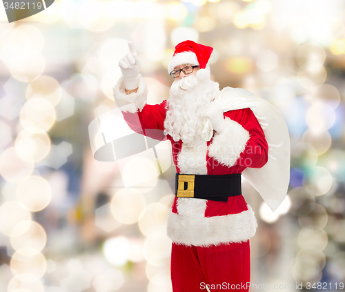 Image of man in costume of santa claus with bag