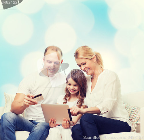 Image of happy family with tablet pc and credit card