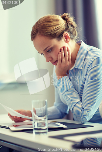 Image of businesswoman having problem in office