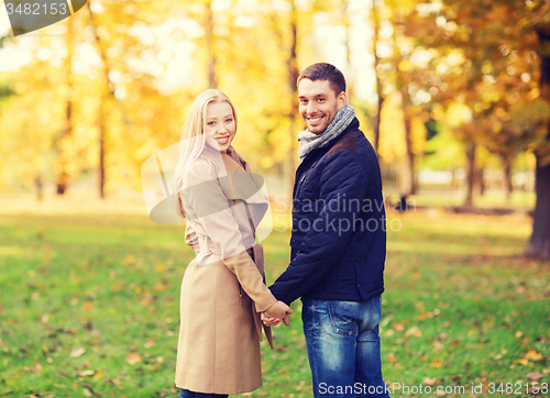 Image of smiling couple in autumn park