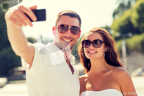 Image of smiling couple in city