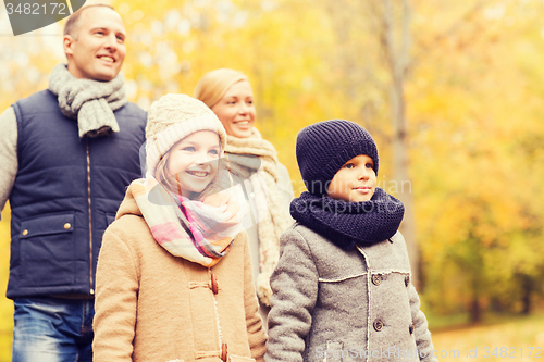 Image of happy family in autumn park