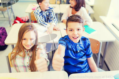 Image of group of school kids showing thumbs up