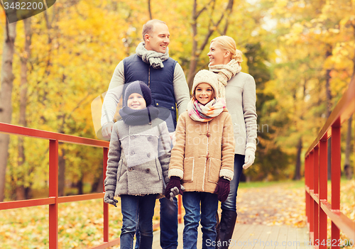 Image of happy family in autumn park