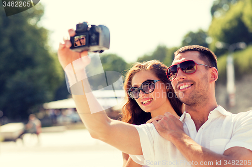 Image of smiling couple in city