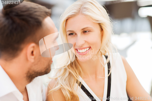 Image of happy couple faces at restaurant