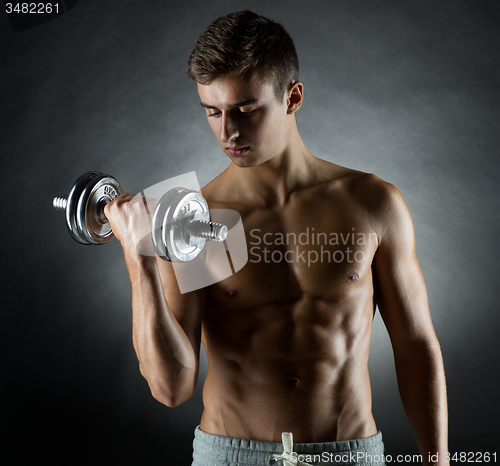 Image of young man with dumbbell